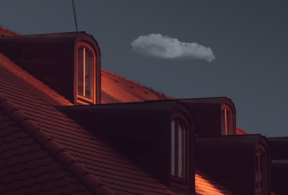 a view of the roof of a house at night